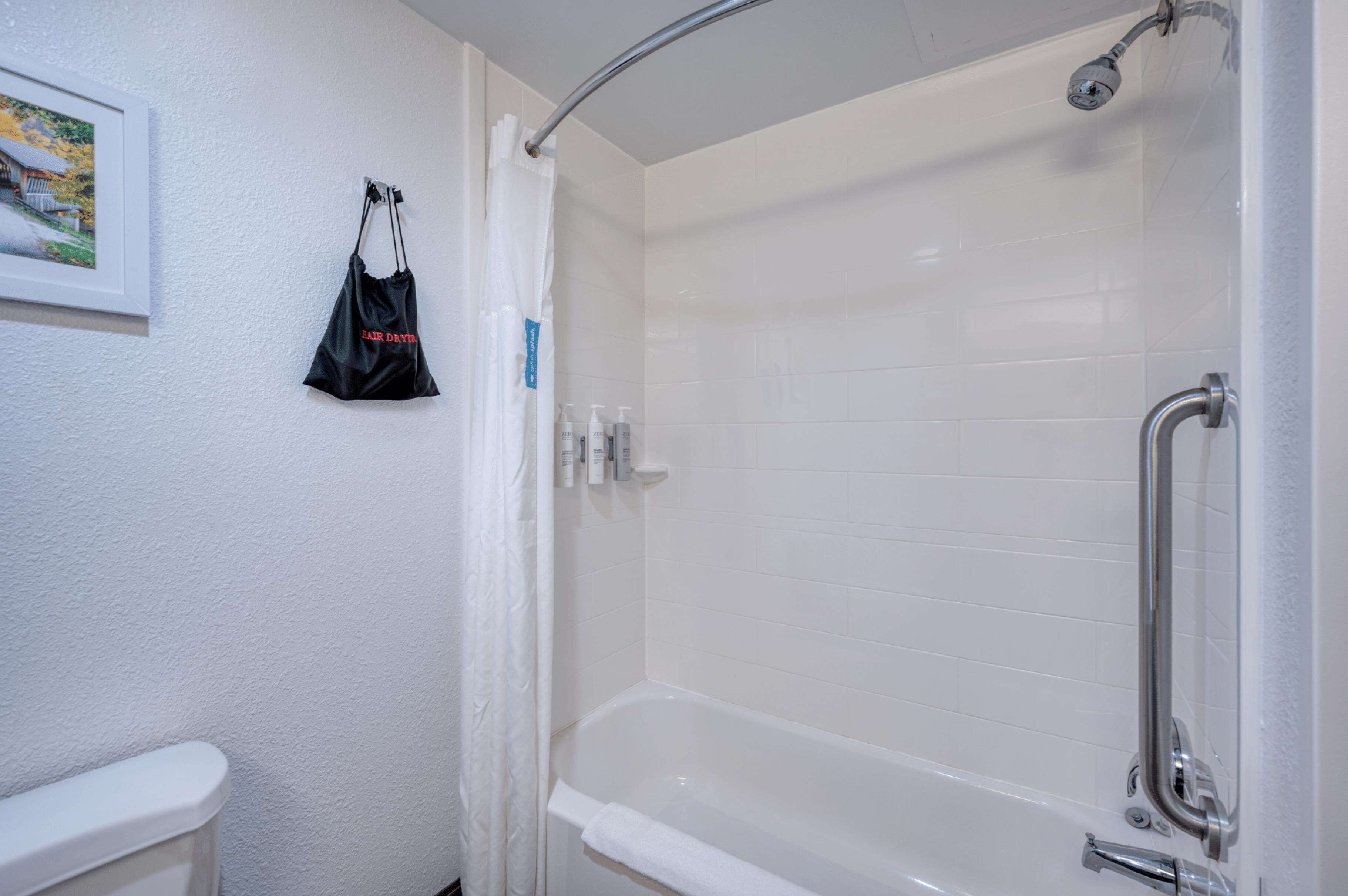 two queen beds non smoking | bathroom | free toiletries, hair dryer, towels, soap