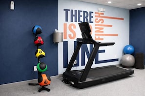 A gym with a treadmill, exercise balls, and a motivational wall. - Hampton Inn by Hilton Washington Court House (Jeffersonville)