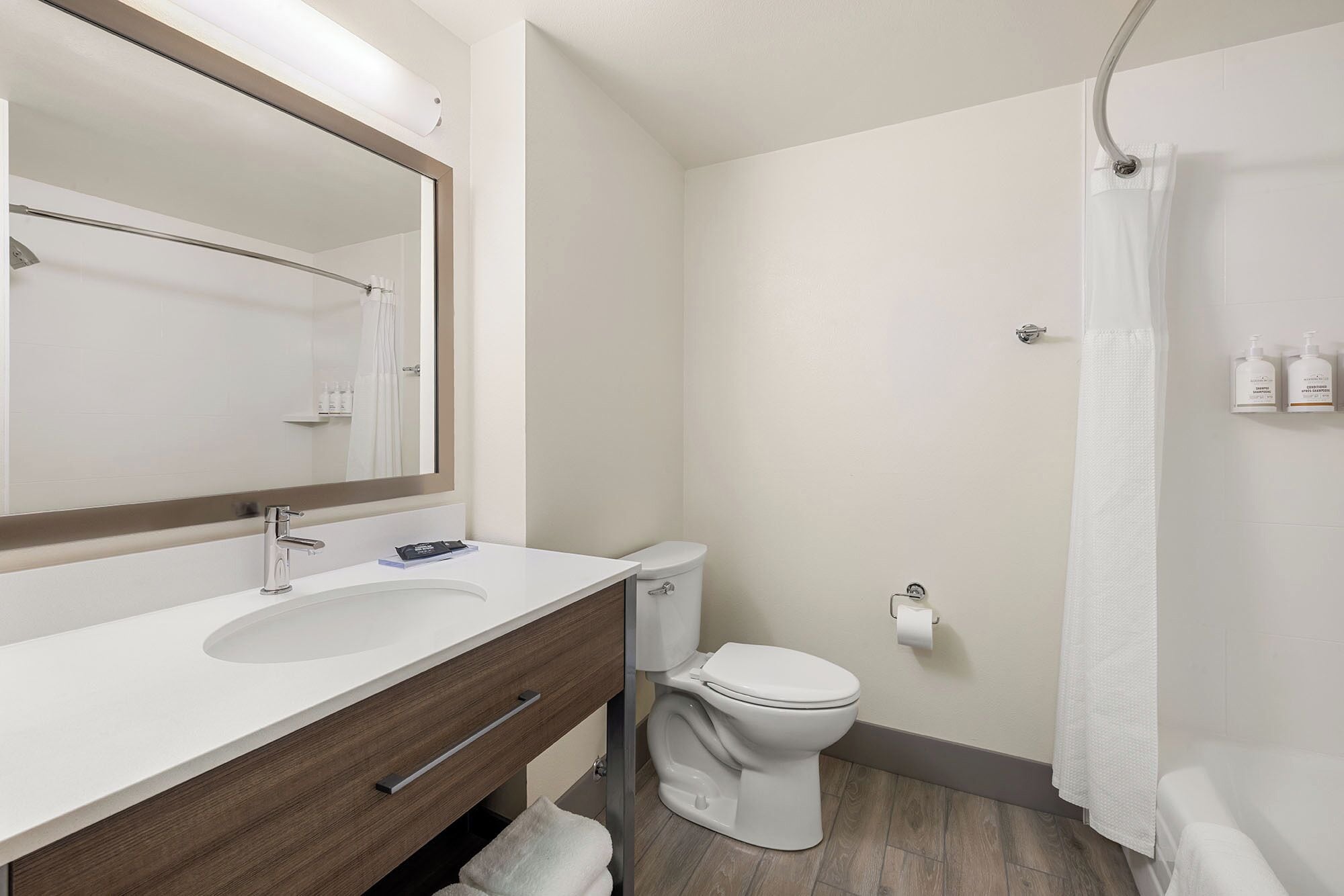 hydromassage showerhead, eco-friendly toiletries, hair dryer, towels