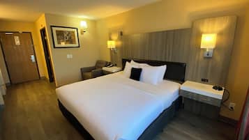 Premium bedding, desk, laptop workspace, blackout curtains