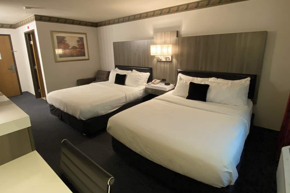 Premium bedding, desk, laptop workspace, blackout curtains