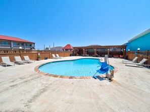 Outdoor pool, open 9:00 AM to midnight, pool loungers