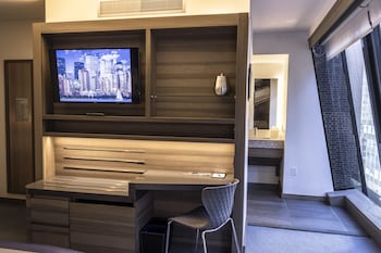 Premium bedding, down comforters, in-room safe, desk at Carnegie Hotel