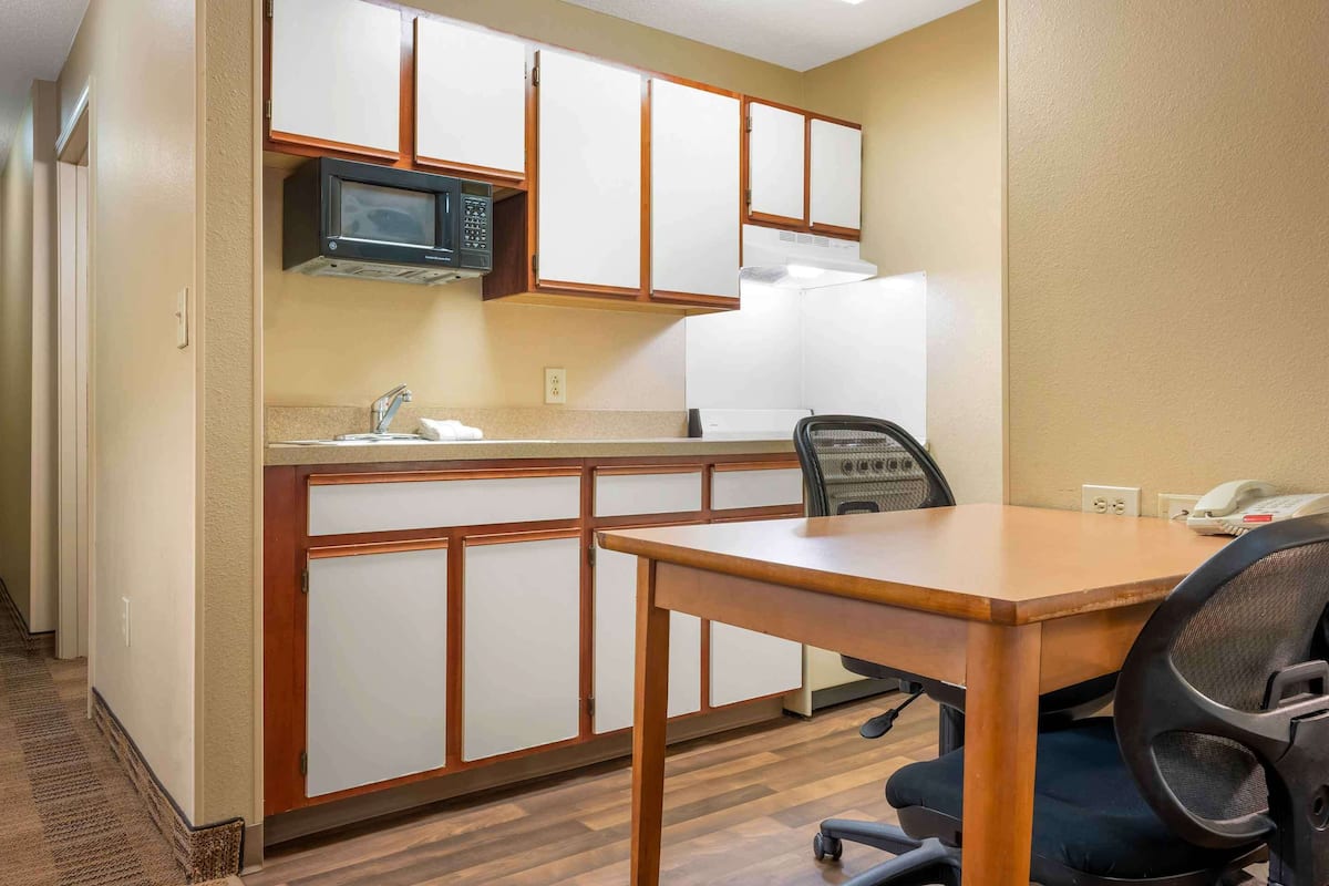 desk, laptop workspace, blackout curtains, iron/ironing board