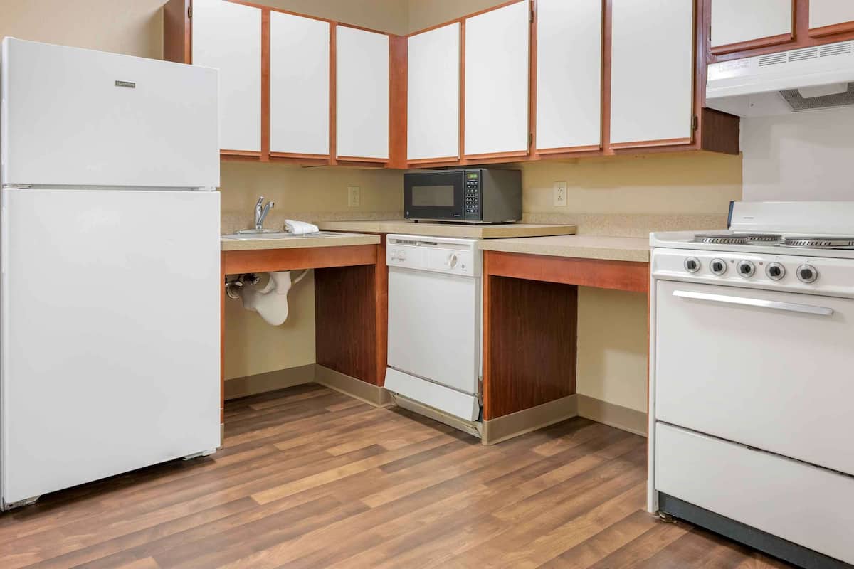 desk, laptop workspace, blackout curtains, iron/ironing board