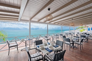 Breakfast, lunch, dinner served; beach views 