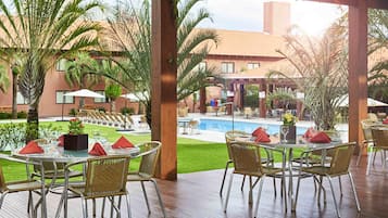 Outdoor pool, open 8:00 AM to 8:00 PM, pool loungers
