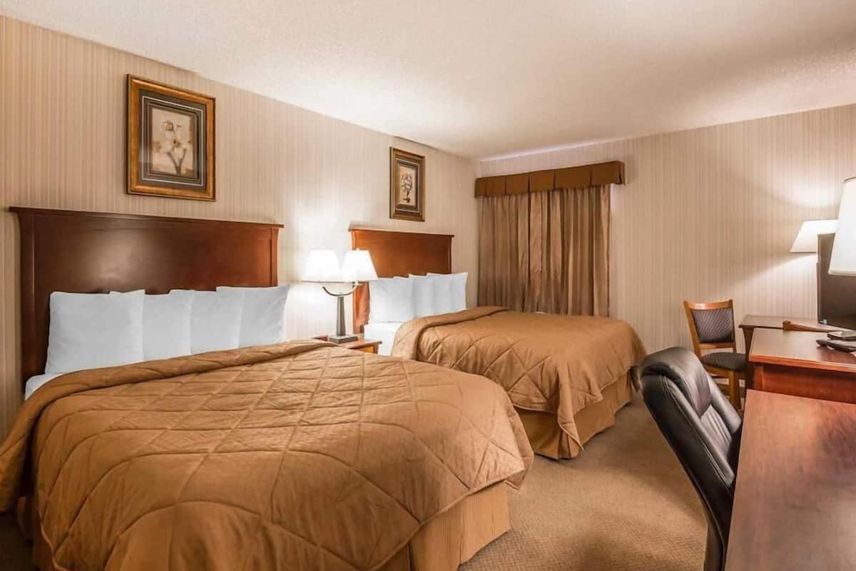 Pillowtop beds, desk, blackout drapes, iron/ironing board