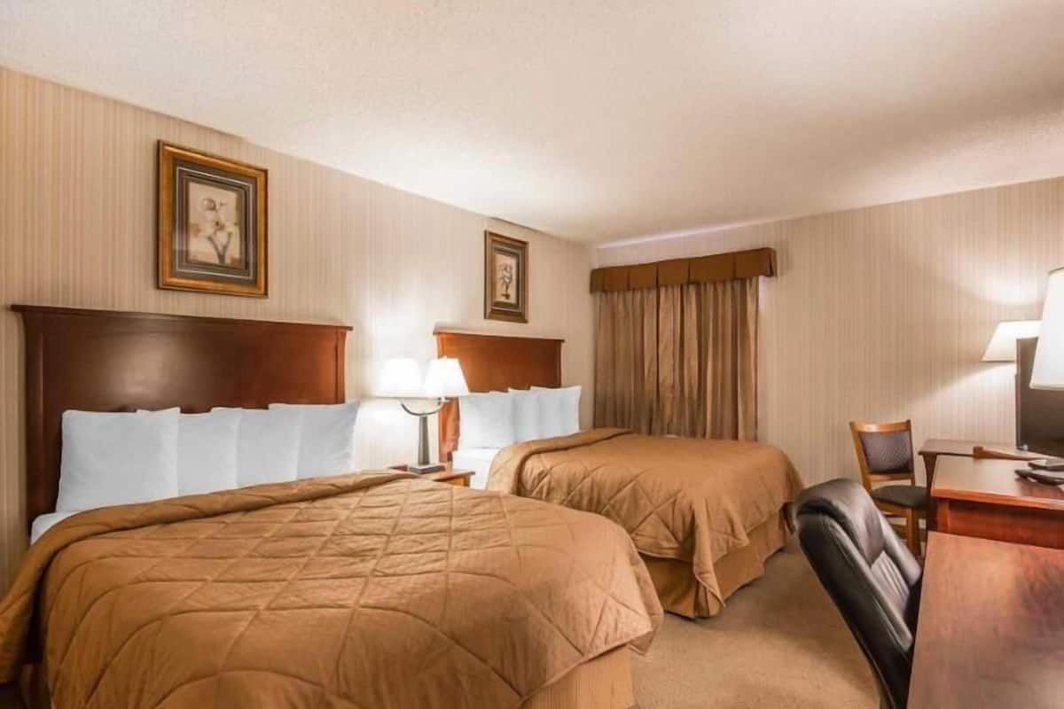 Pillowtop beds, desk, blackout drapes, iron/ironing board