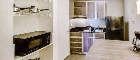 Fridge, microwave, stovetop, coffee/tea maker