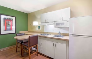 Full-size fridge, microwave, stovetop, coffee/tea maker