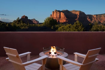 A residential area with houses, a road, and a mountain in the background. at Hilton Sedona Resort at Bell Rock