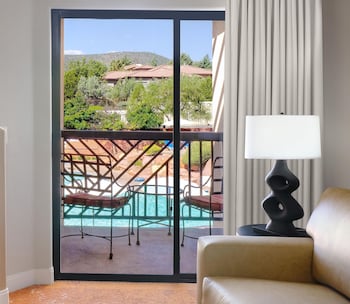 Suite, 1 King Bed, Balcony, Pool View | Premium bedding, down comforters, pillowtop beds, in-room safe at Hilton Sedona Resort at Bell Rock