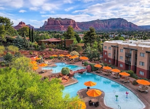 2 outdoor pools, open 7:00 AM to 11:00 PM, pool umbrellas, pool loungers