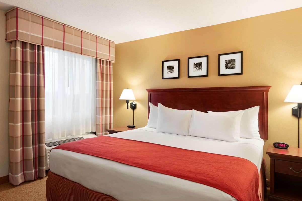 Desk, blackout drapes, iron/ironing board, rollaway beds