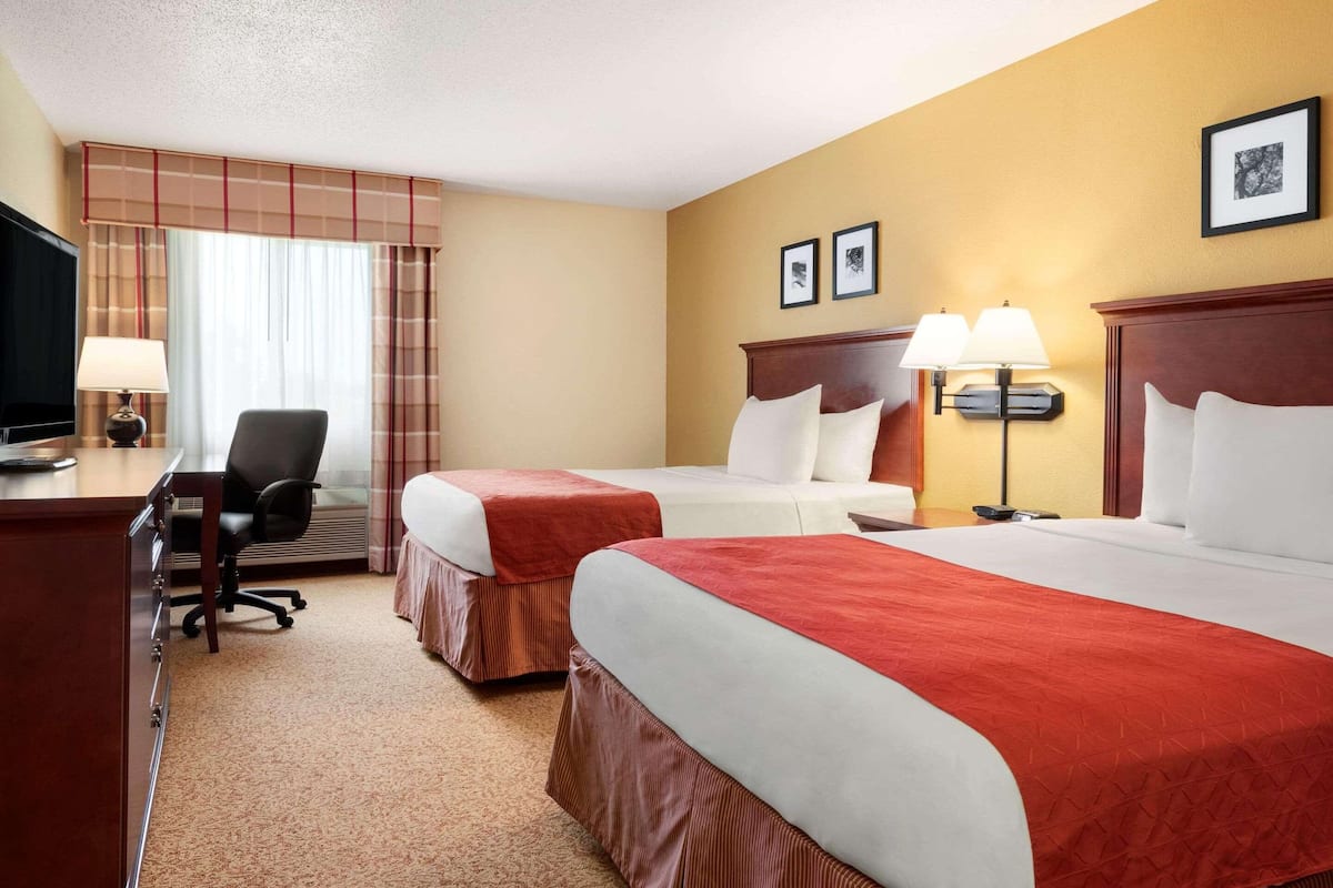 Desk, blackout drapes, iron/ironing board, rollaway beds