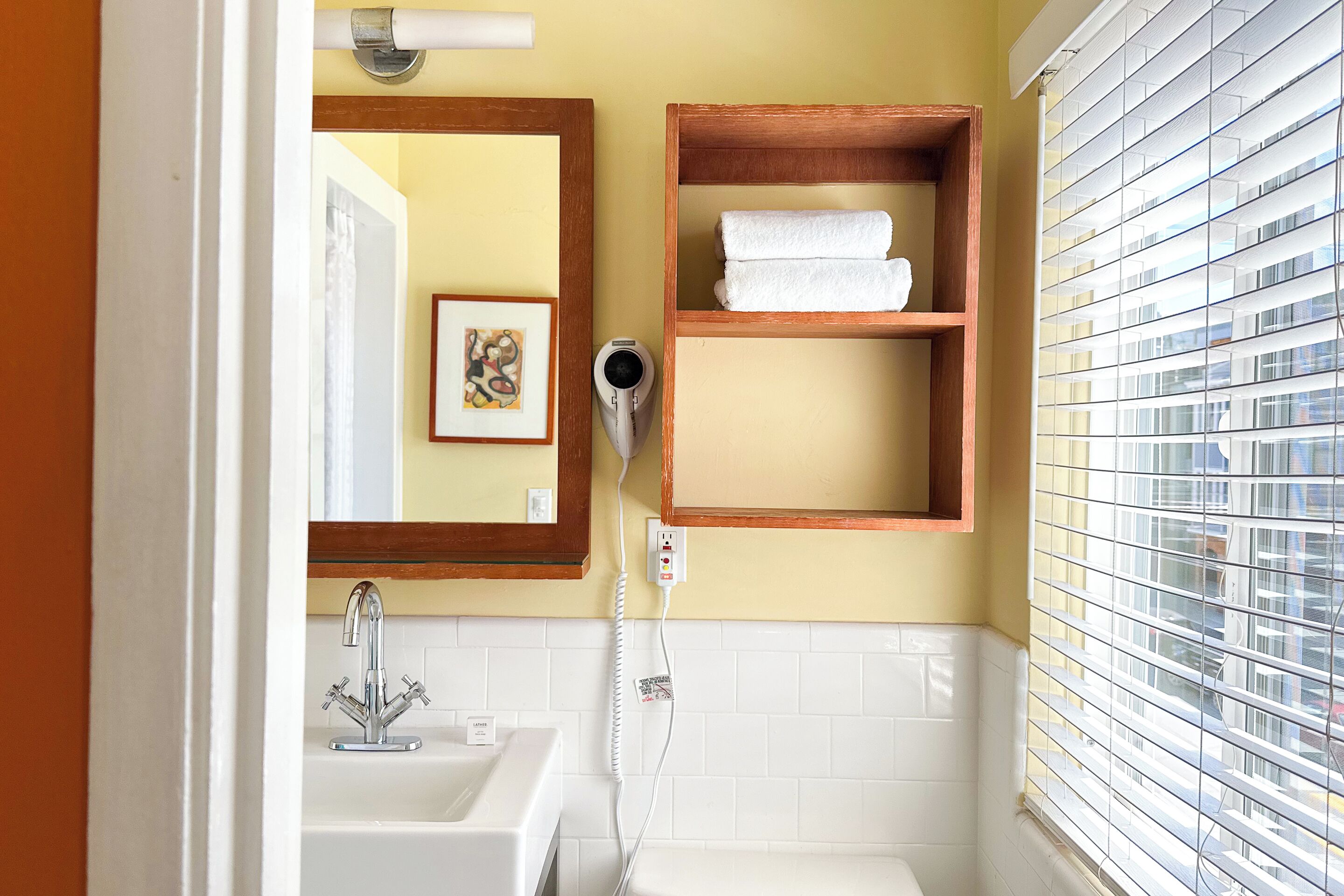 designer toiletries, hair dryer, towels, soap