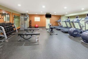 A gym with treadmills, weight machines, and dumbbells. - Hilton Garden Inn Pittsburgh University Place (Pittsburgh)