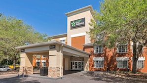 A hotel with a sign for 'Extended Stay America' and a lobby entrance.