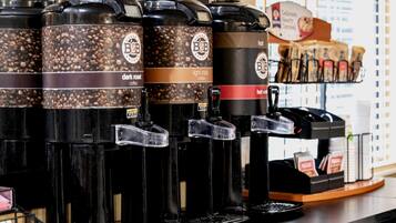 A coffee shop with multiple coffee dispensers labeled 'dark roast' and 'light roast'.