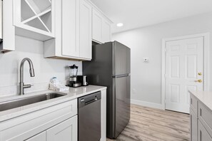 Presidential Suite | Private kitchenette | Coffee/tea maker, mini-fridge, microwave, dining tables - Coconut Malorie Resort Ocean City, an Ascend Collection Hotel (Ocean City)