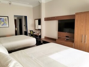 A hotel room with two beds, a desk, a TV, and a wardrobe. - Holiday Inn Express Columbia NE - Fort Jackson by IHG (Columbia)