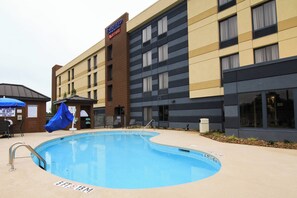 Seasonal outdoor pool, open 9:00 AM to 9:00 PM, pool umbrellas