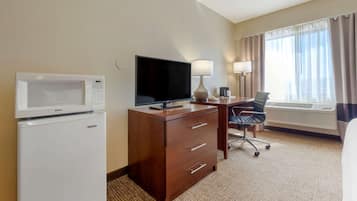 Desk, laptop workspace, blackout drapes, iron/ironing board