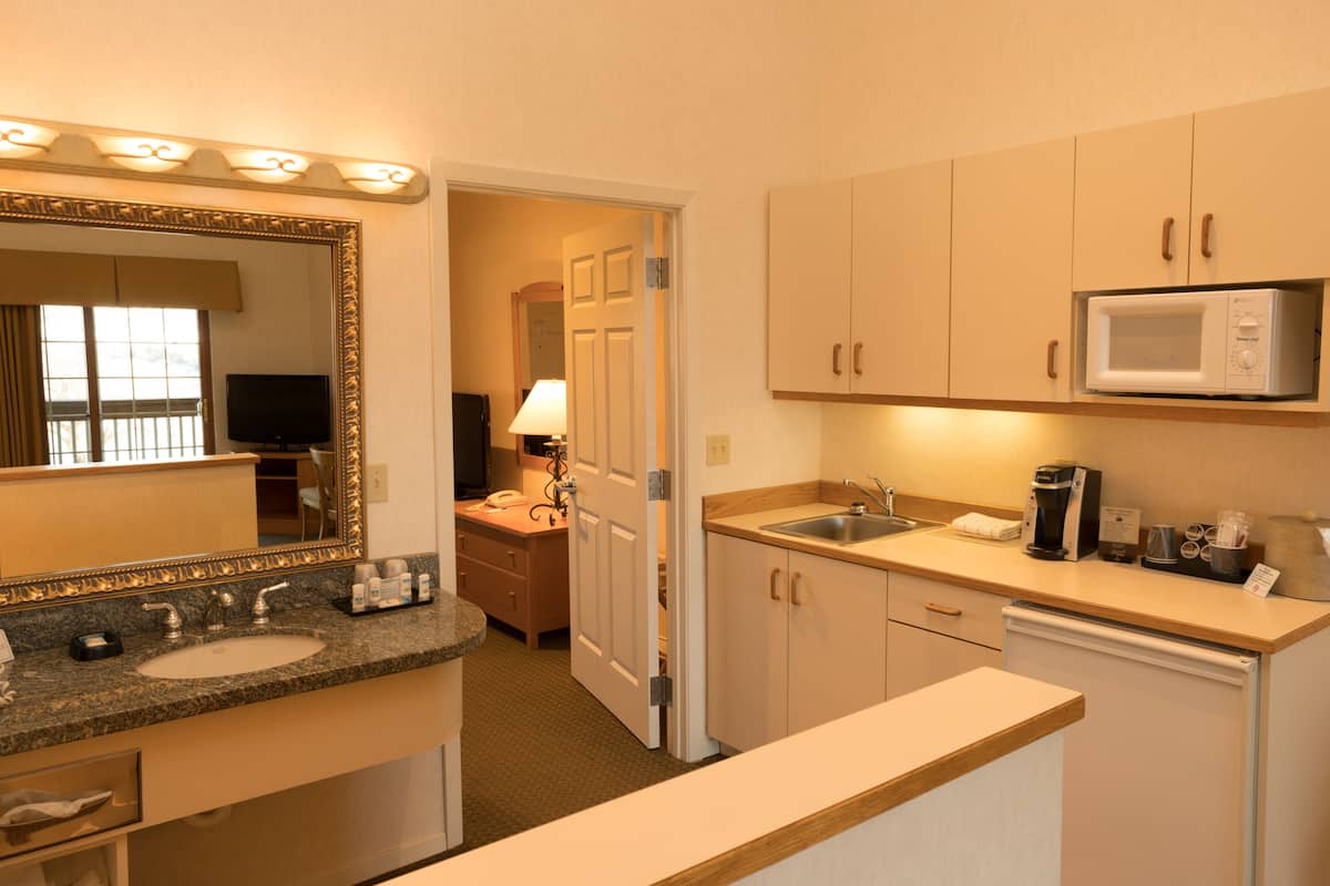 fridge, coffee/tea maker, cookware/dishes/utensils