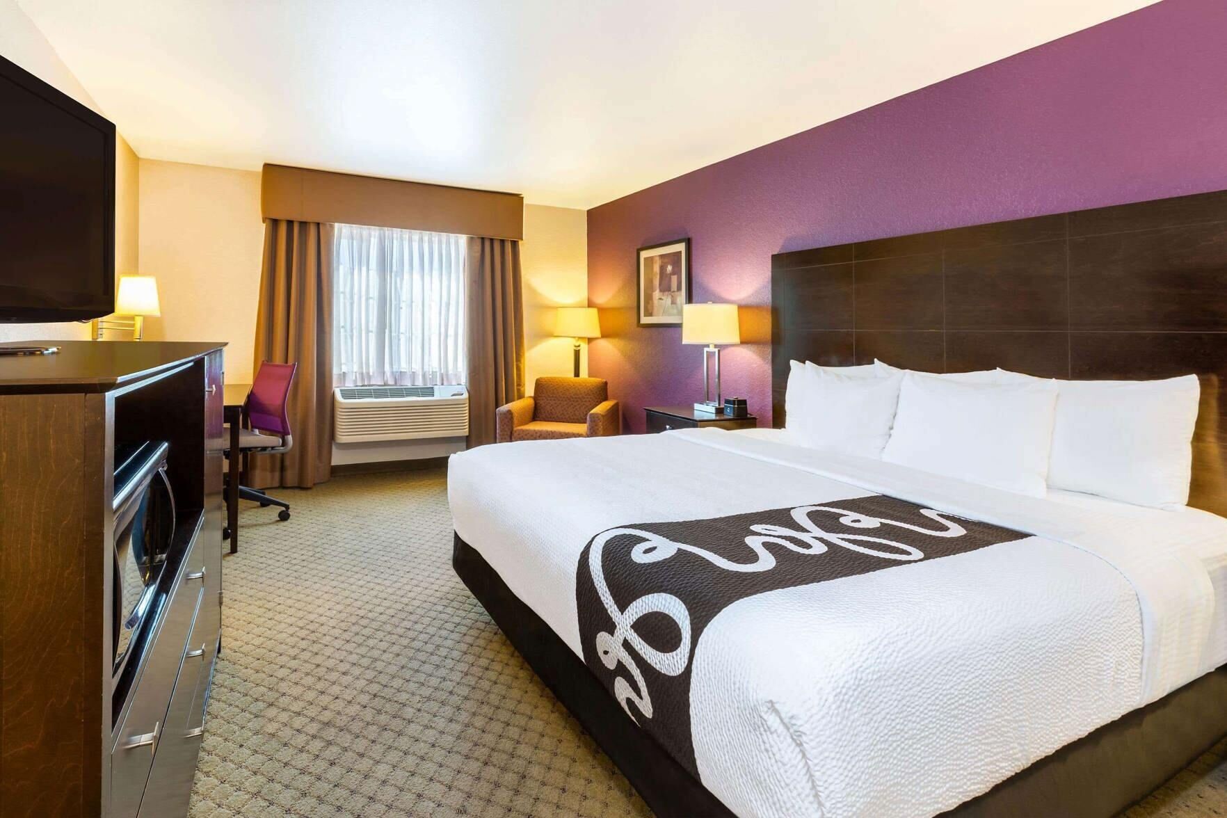 Premium bedding, pillowtop beds, laptop workspace, blackout drapes