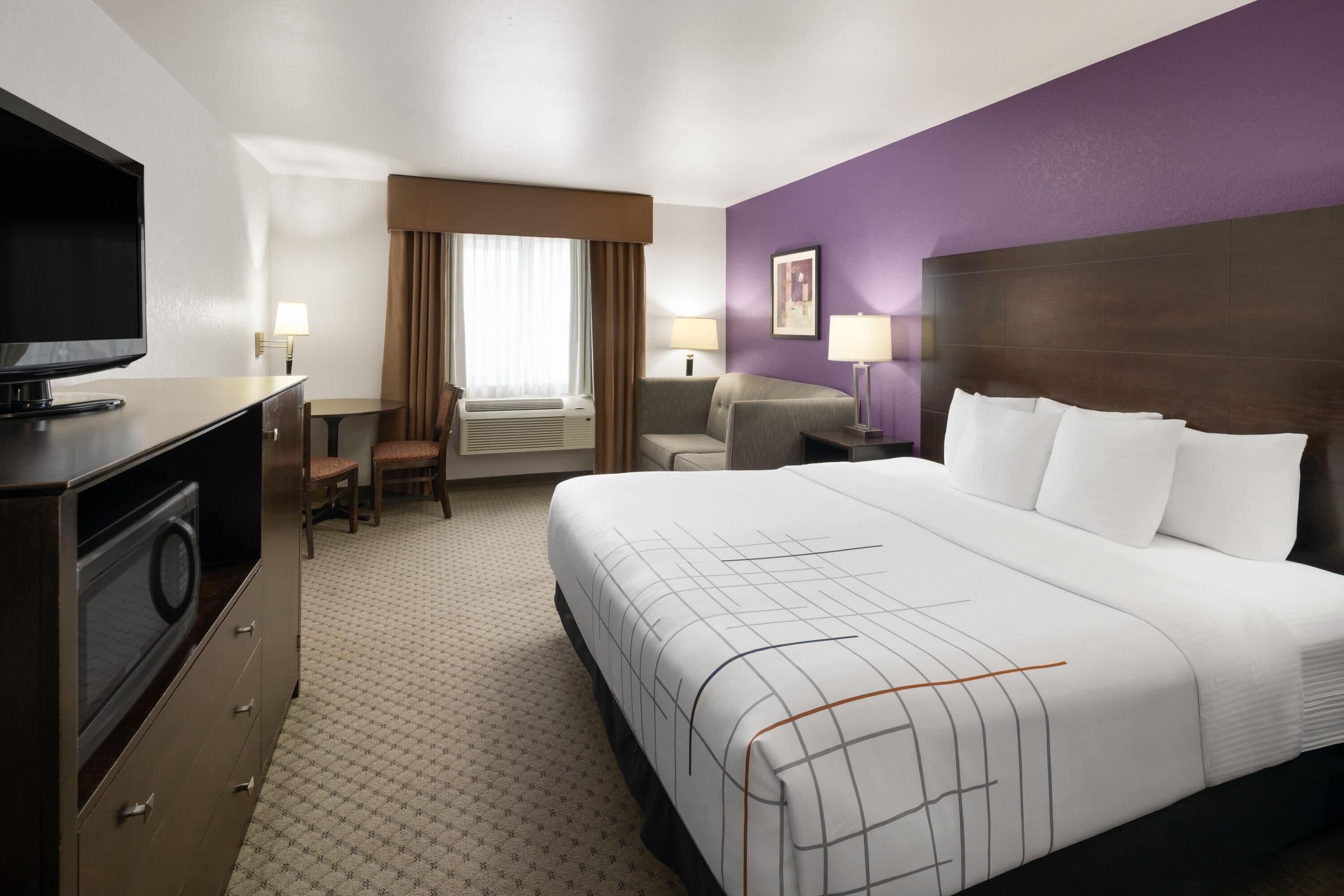 Premium bedding, pillowtop beds, laptop workspace, blackout drapes