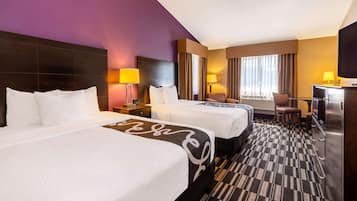 Premium bedding, pillowtop beds, laptop workspace, blackout drapes
