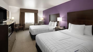 Premium bedding, pillowtop beds, laptop workspace, blackout drapes