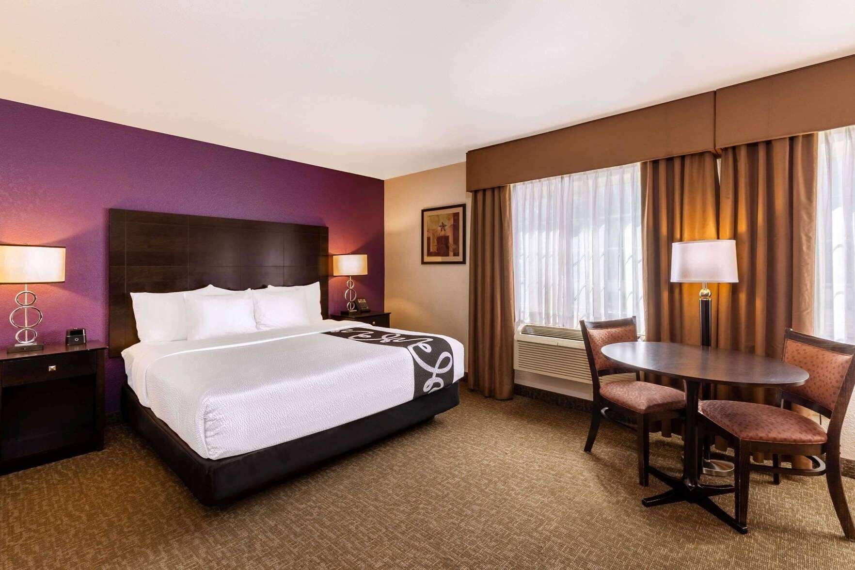 Premium bedding, pillowtop beds, laptop workspace, blackout drapes