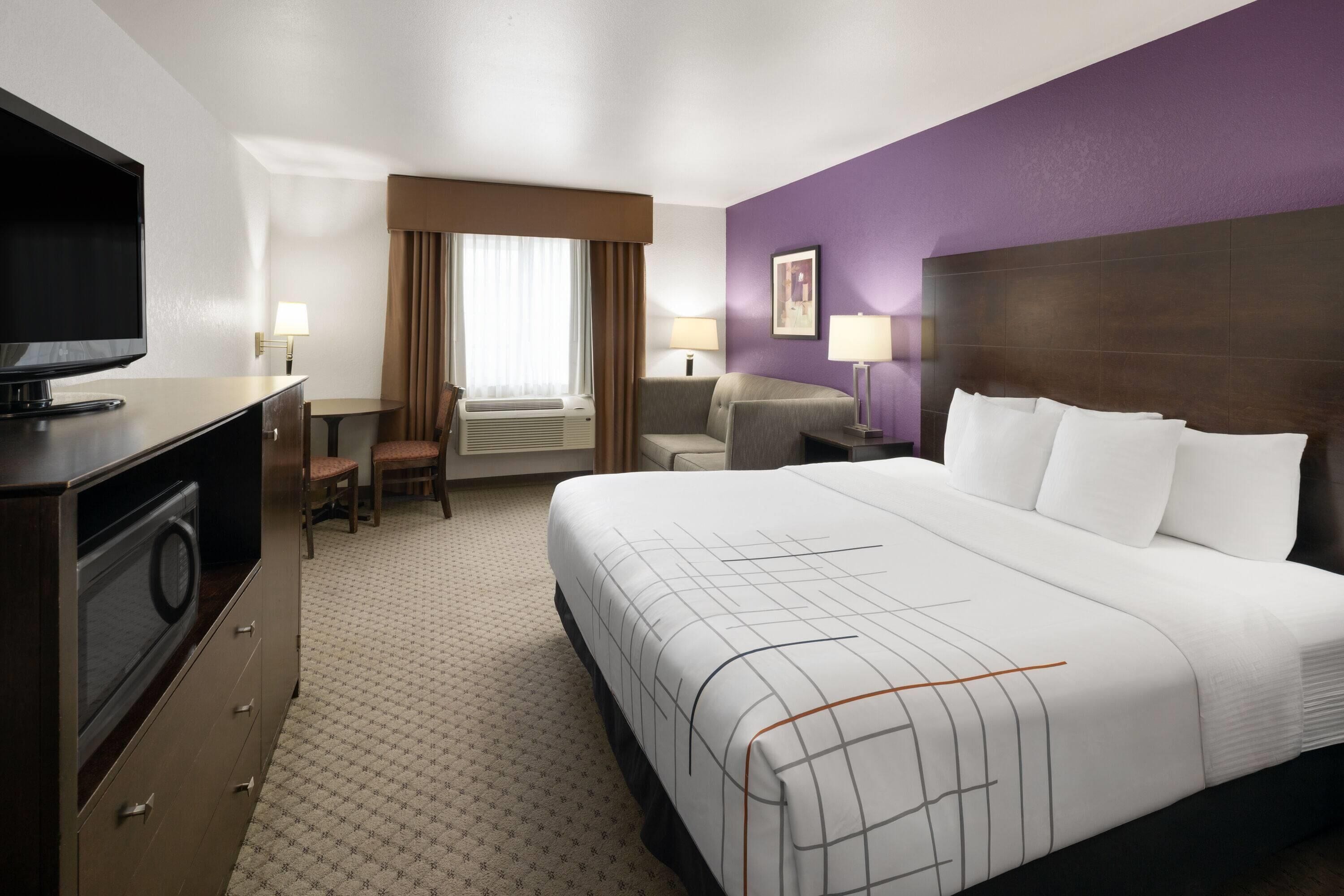 Premium bedding, pillow-top beds, laptop workspace, blackout curtains