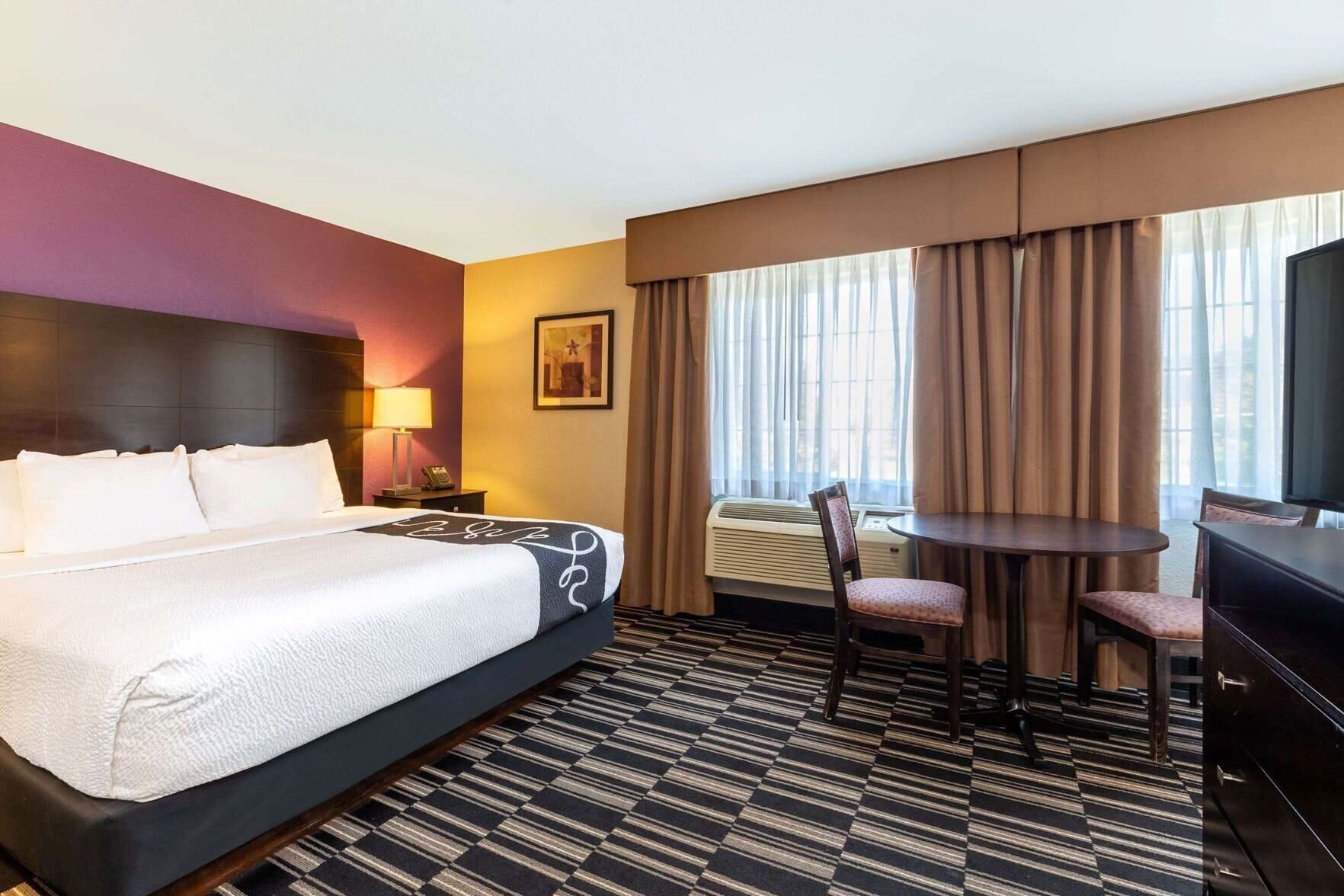 Premium bedding, pillowtop beds, laptop workspace, blackout drapes