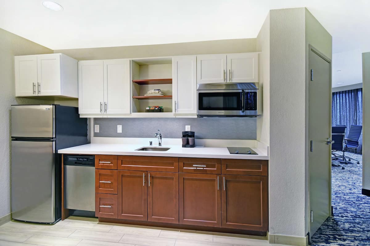 suite, 1 bedroom (1 king bed, boardroom table for 12) | private kitchen | full-sized fridge, microwave, stovetop, dishwasher