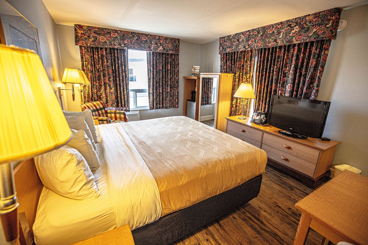 Premium bedding, desk, laptop workspace, iron/ironing board
