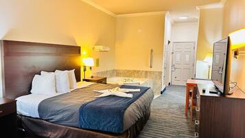 Premium bedding, desk, laptop workspace, iron/ironing board