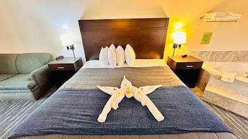 Premium bedding, desk, laptop workspace, iron/ironing board