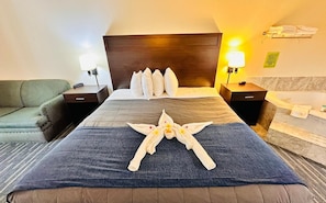 Premium bedding, desk, laptop workspace, iron/ironing board