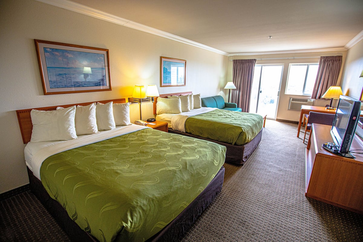 Premium bedding, desk, laptop workspace, iron/ironing board