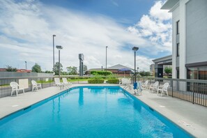 Outdoor pool, open 10:00 AM to 10:00 PM, pool loungers
