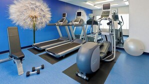 A gym with treadmills, elliptical machines, a stationary bike, and free weights. - SpringHill Suites Phoenix North (Phoenix)