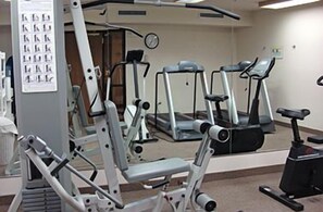 A gym with various exercise machines including a treadmill, elliptical, and weight machines. - Comfort Inn Benson near Kartchner Caverns (Benson)