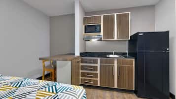 Fridge, microwave, coffee/tea maker, cookware/dishes/utensils