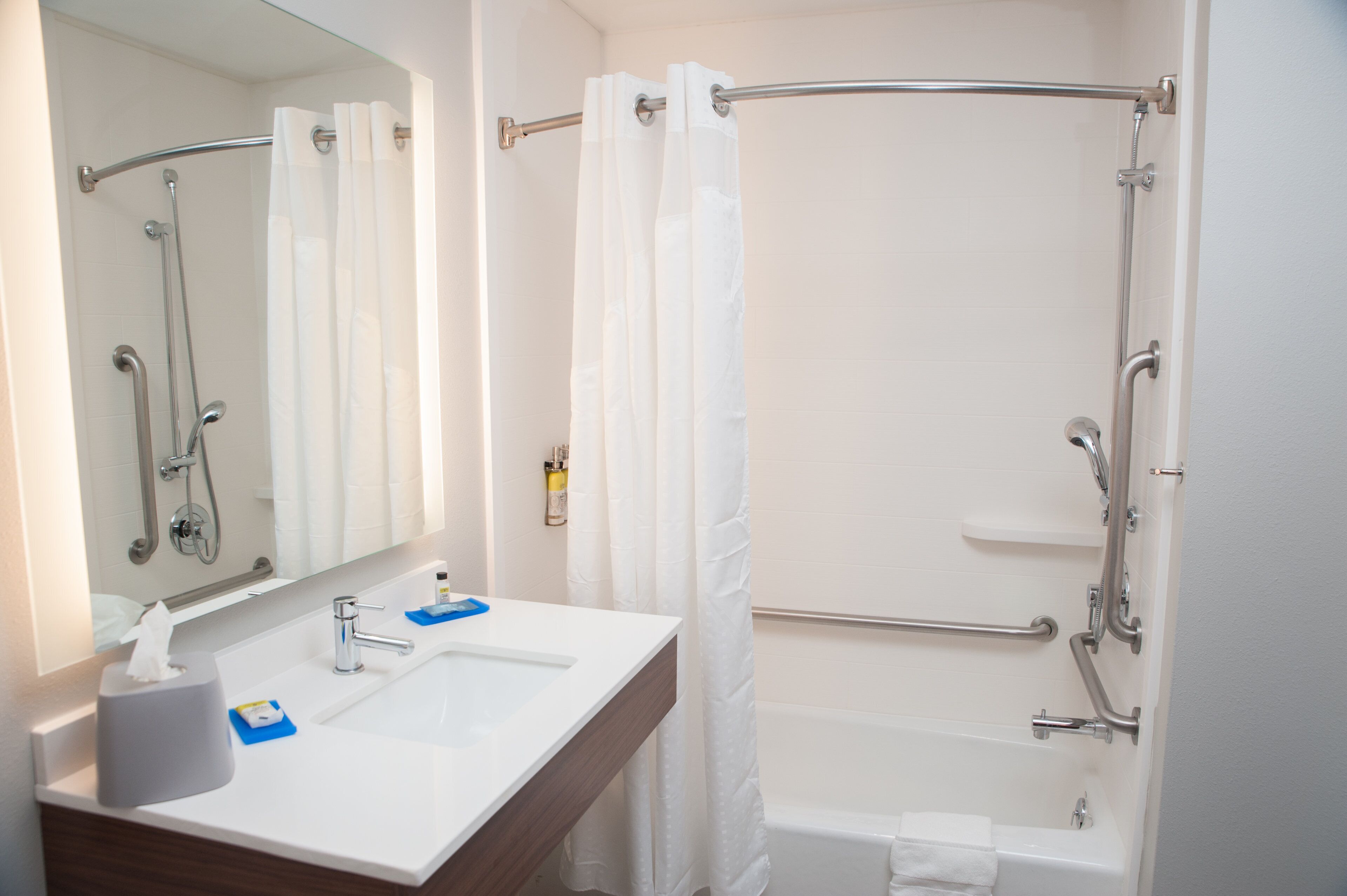 rainfall showerhead, designer toiletries, hair dryer, towels