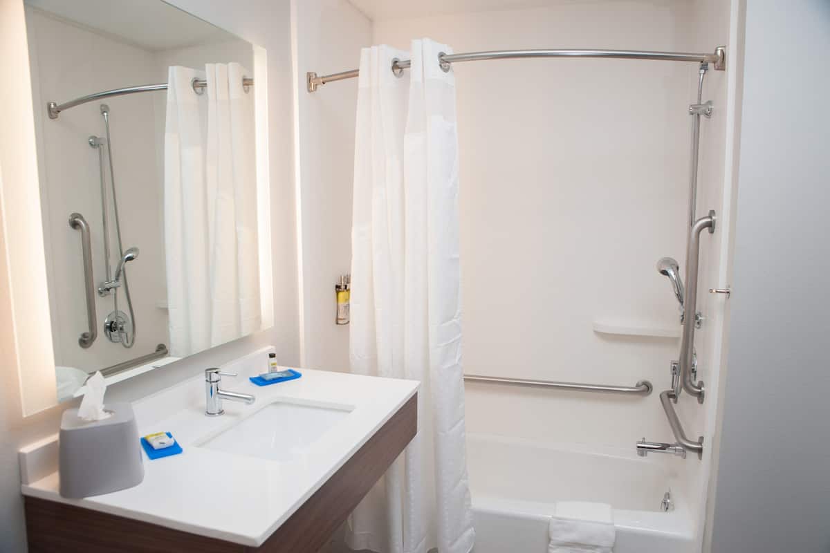 rainfall showerhead, designer toiletries, hair dryer, towels