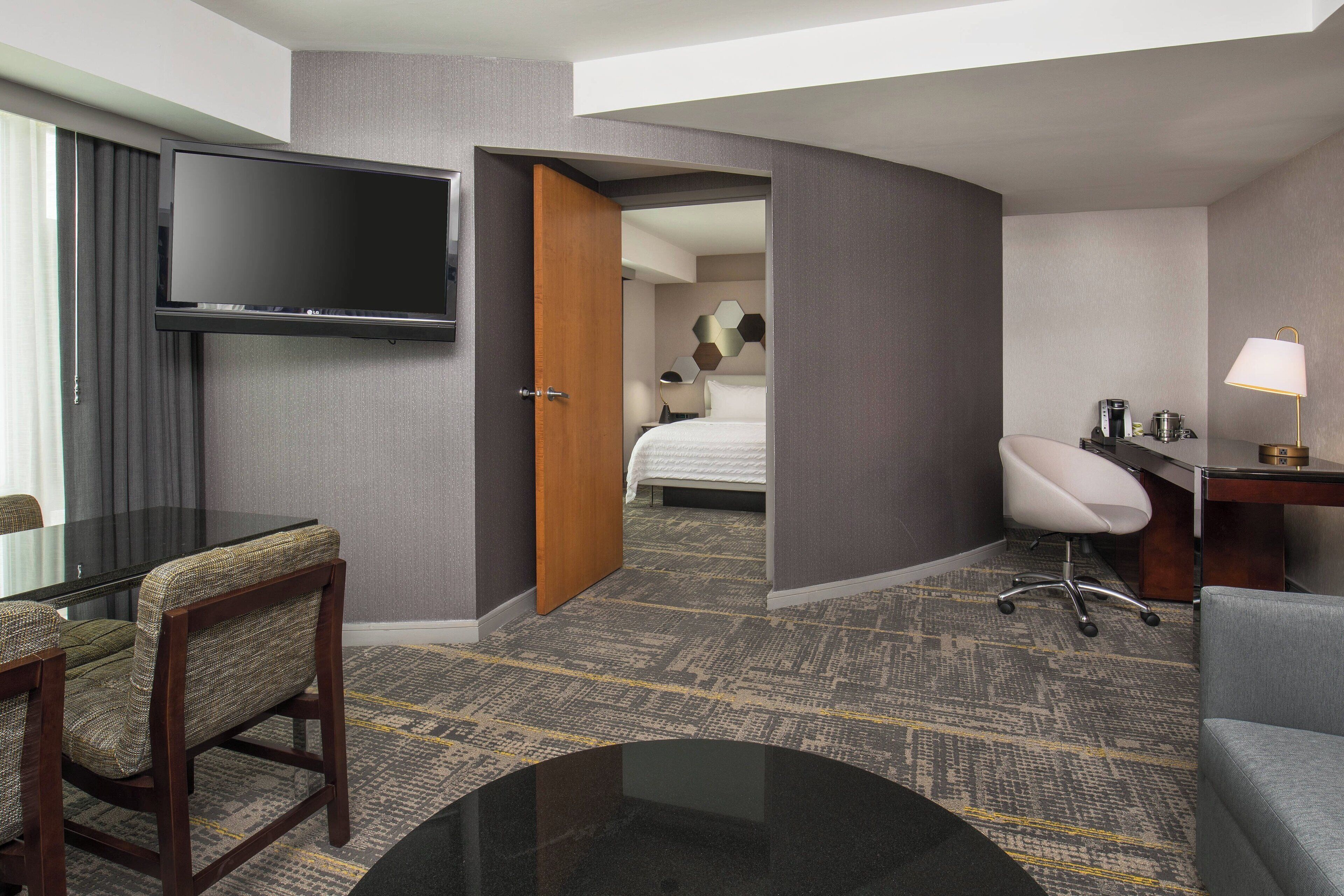 deluxe suite, 1 king bed with sofa bed, non smoking | premium bedding, in-room safe, desk, iron/ironing board