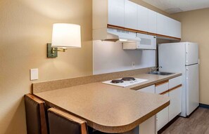 Studio, 1 Queen Bed, Non Smoking | Private kitchen | Full-size fridge, microwave, stovetop, coffee/tea maker